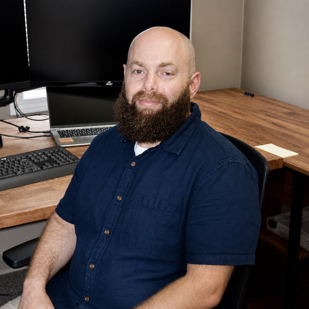 Ryan Gendron, owner of Gendron Small Business Services, at his desk
